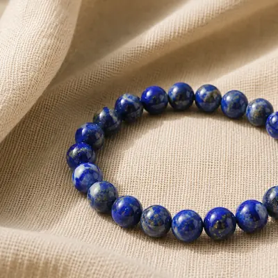 LAPIS — Lapislazuli-Perlenarmband auf Leinen