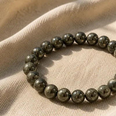 PYRITE — Pyrit-Perlenarmband auf Leinen