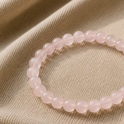 ROSE — Rosenquarz-Perlenarmband auf Leinen